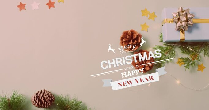 Animation of christmas greetings text over christmas presents and decorations