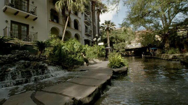 San Antonio Riverwalk Boat POV With Waterfall. Slow Motion.