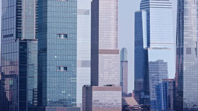 Hudson Yards skyscrapers facade panning in New York City. Hudson Yards is a neighborhood on the West Side of Midtown Manhattan in NYC.