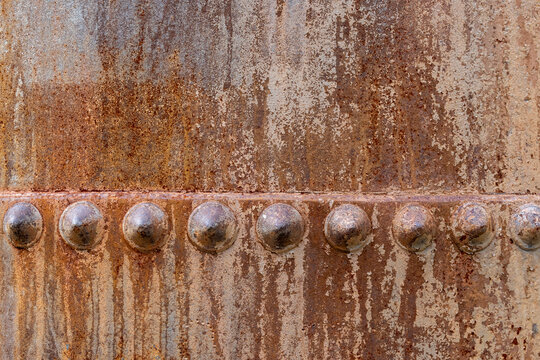 Rusty metal with rivets and texture