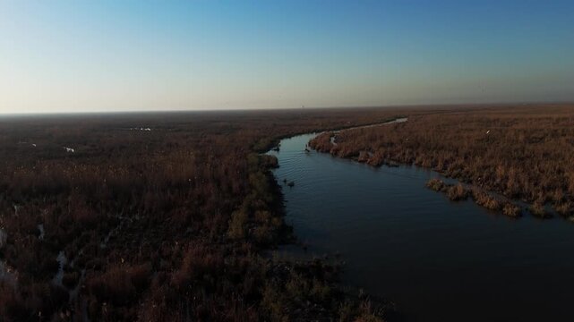The Al-Jubaysh Marshes, located in Dhi Qar, Iraq, are part of the Mesopotamian marshlands, one of the world's largest wetland ecosystems. Known for their rich biodiversity, these marshes are home to u
