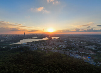 Obraz premium Aerial view of modern city at sunset