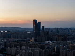 Obraz premium Aerial view of modern city at sunset