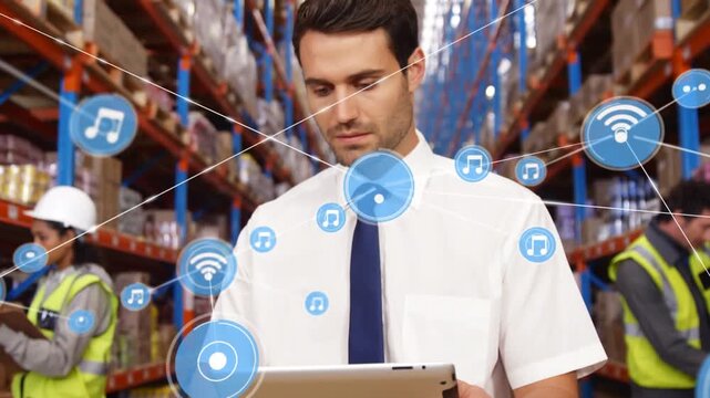 Animation of network of digital icons on caucasian male supervisor using digital tablet at warehouse