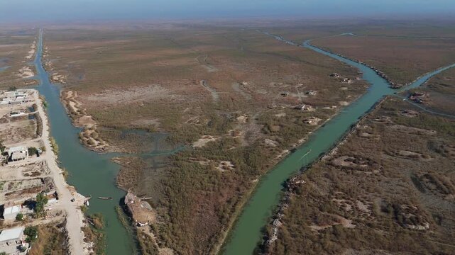 The Al-Jubaysh Marshes, located in Dhi Qar, Iraq, are part of the Mesopotamian marshlands, one of the world's largest wetland ecosystems. Known for their rich biodiversity, these marshes are home to u