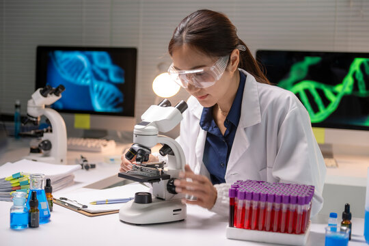 Female scientist researching dna sequencing in a laboratory