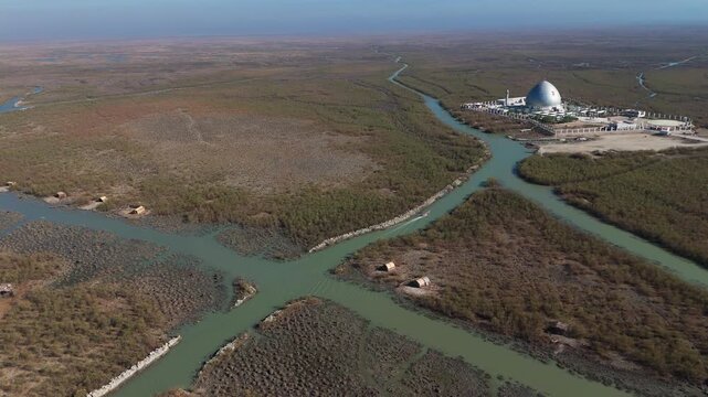 The Al-Jubaysh Marshes, located in Dhi Qar, Iraq, are part of the Mesopotamian marshlands, one of the world's largest wetland ecosystems. Known for their rich biodiversity, these marshes are home to u