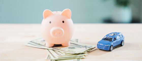 Pink piggy bank to save money for auto car fuel and refinance loan, finance gas transportation cost while managing personal budget for monthly vehicle insurance and drive cost © sorapop