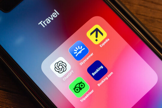 Mexico City, MEXICO - Mar 19 2026 : Close-up of an iPhone screen showing icons of ChatGPT, Skyscanner, Expedia, Booking.com, and Tripadvisor apps, illustrating AI use in travel planning and OTA concep