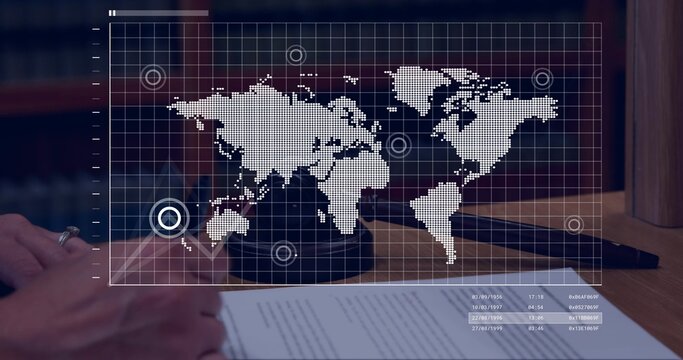 Overlaying faint world map over wooden desk in law office showing gavel document ring dark sleeve