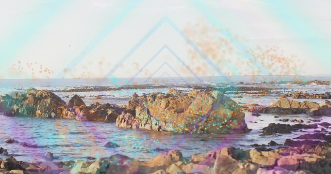 Rock staying centered while sequence starting, triangles and particles rising, enhancing design