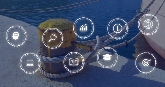 Securing yellow bollard anchoring thick braided ropes on pier, with boat hull and digital icons