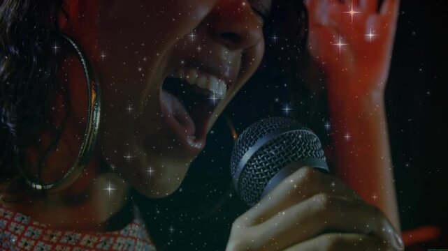 Woman singer bringing mic close, singing, expressing lyrics in music, with sparkle overlay on frame