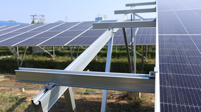 Aluminum frame for solar panels. Close-up of some of the structures for installing solar panel kits in a clean energy solar farm with copy space available by selecting focus.