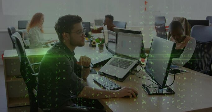 Green code appearing and rising, causing man leaning and typing on laptop handling business data