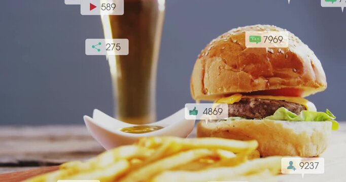 Burger, fries, beer on wood table, social bubbles growing, hiding burger as counters rising, promo