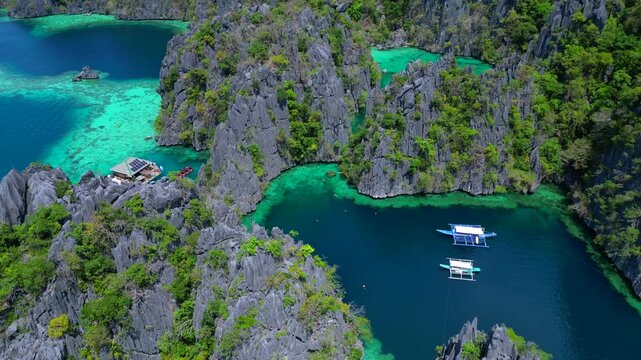 Palawan cliffs, Philippines boat, turquoise water. Amazing aerial view drone