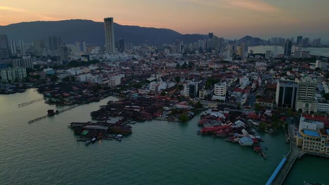George Town Penang clan jetties cityscape at dusk. Amazing aerial view drone