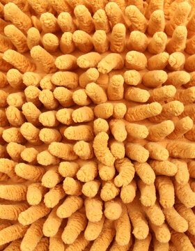 Abstract Close Up of Golden Yellow Bobble Chenille Fabric Texture Background

