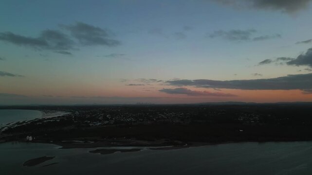 Last light looking at the silhouette of the city and surrounding suburbs as the sunset has almost set.