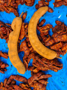 Tamarind, a tropical fruit with a sweet and sour taste, is used as an ingredient in cooking.