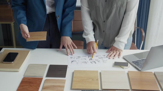 Two Interior Designers Collaborating in Office