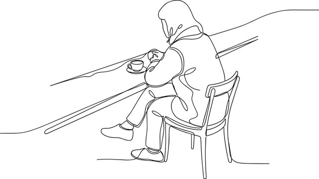 Person sitting on a chair playing.