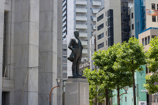Osaka, Japan - June 29, 2025: A bronze statue of Godai Tomoatsu stands in front of the Osaka Exchange building (formerly the Osaka Securities Exchange) in Kitahama, Chuo Ward.