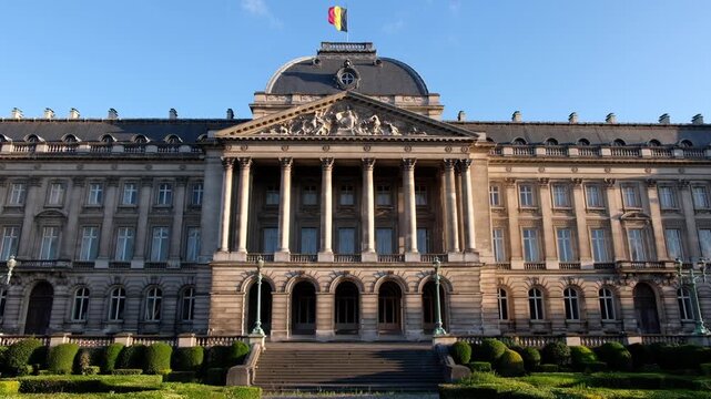 Belgian royal palace facade exterior daytime slow motion establishing shot with flag.