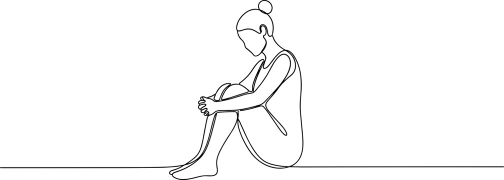 Sad woman sitting alone depressed.