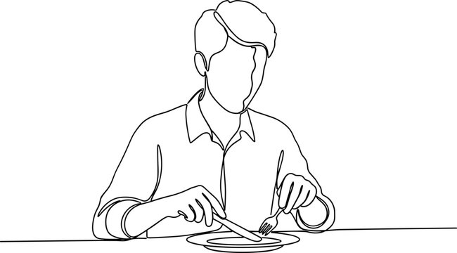 Man eating with fork and knife.