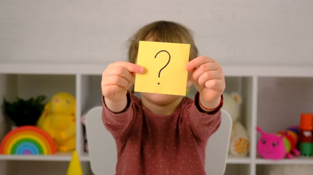 The child learns English letters. Selective focus. Kid.