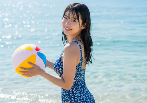 青い海を背景に花柄の水着とビーチボールで遊ぶ笑顔の女性