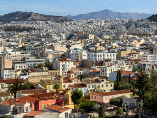 Fototapeta premium Athens cityscape and surrounding hills, dense apartment blocks beyond. Athens Old town view from above, Greece