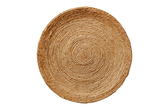 Round straw placemat with spiral weave pattern isolated on transparent background, offering natural texture and rustic charm