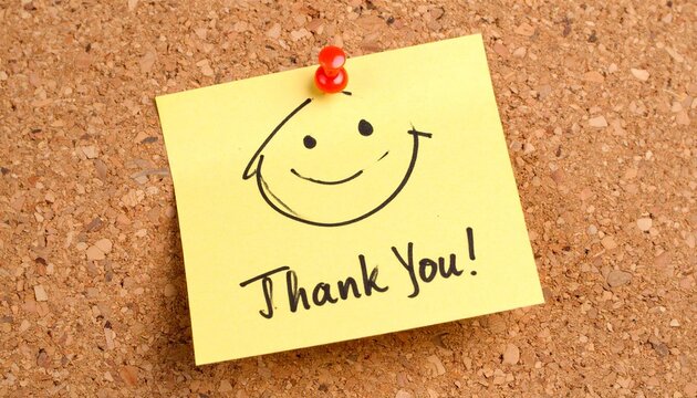 Yellow sticky note smiley face thank you corkboard pinned