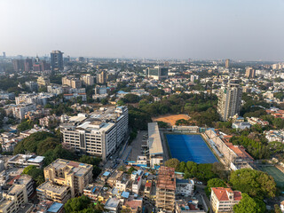 Naklejka premium Aerial view of the modern high-rise skyscrapers in Bengaluru, Karnataka, showcasing the city's dynamic skyline. Cityscape highlights Bengaluru's blend of urban development and architectural brilliance