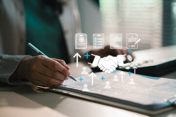 Business professional signing contract document with digital icons overlay, representing partnership, agreement, recruitment, and workflow process. Corporate deal, HR onboardingand legal paperwork