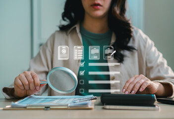 HR professional analyzing checklist and employee data with magnifying glass and digital interface, representing candidate evaluation, recruitment process, audit, and workflow management