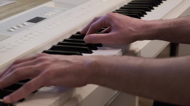 Close up of hands playing digital piano keys, musician performing on keyboard instrument. Emotional music moment, focus and creativity, practice, performance, art and modern lifestyle concept