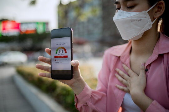 People wearing masks in polluted city air, highlighting smog, respiratory health risks, environmental hazards, poor air quality, and global urban pollution crisis.
