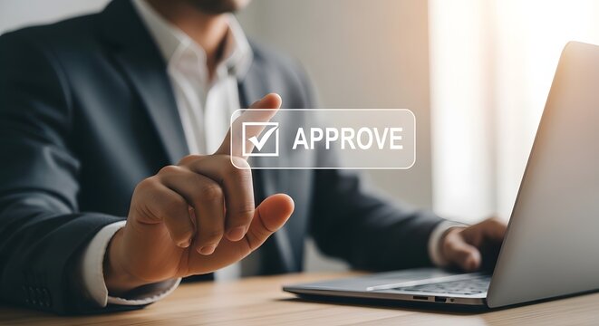 Business professional approving a document on a laptop with a checkmark