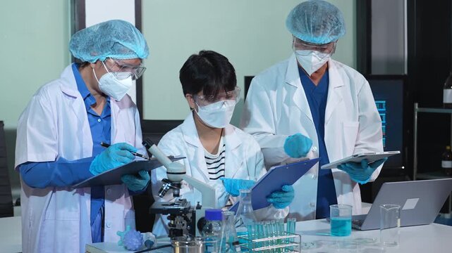 scientist researcher conducting an experiment working in the chemical laboratory.