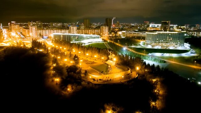 Ufa, Russia. Square named after Salavat Yulaev. Panorama of the city. Night city lights. Drone footage, Departure of the camera