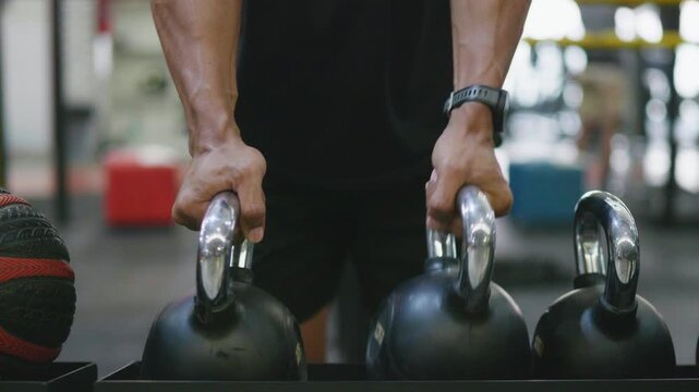 Strength training workout gym fitness activity indoor close-up kettlebell lifting techniques
