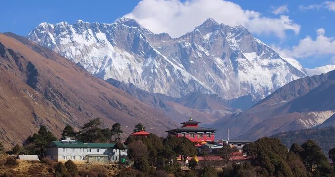 Drone shot of Tengboche Monastery standing peacefully before the snow-capped Everest Himalayan mountain range with surrounding alpine landscape in the Everest region of Nepal.