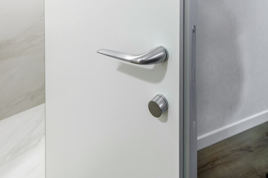 Minimalist Silver Door Handle without Rosette on White Door