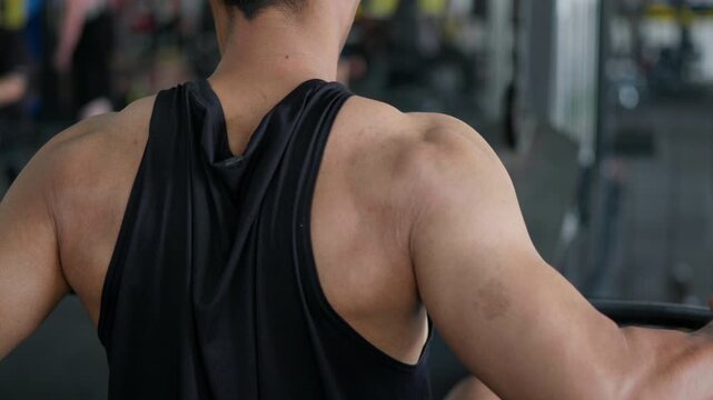 Strength training action gym fitness routine indoor environment close-up view muscle building concept