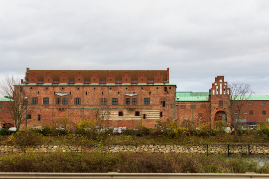 Historic red brick castle facade of Malm&ouml;hus under a cloudy sky in Malm&ouml; Sweden