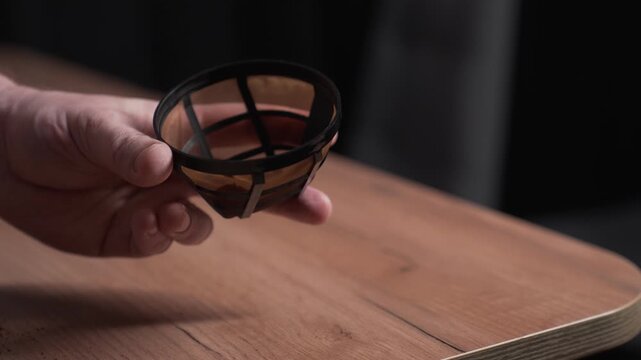 Coffee preparation procedure. Pour the coffee into a strainer